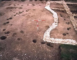 Roundhouse overlying  Bronze age ring ditch at Barcombe